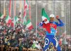 Christian Zorzi crosses the line to claim gold for Italy in the 4 x 10km cross-country relay in front of a delighted home crowd.jpg
