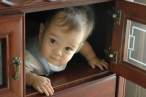 Kyle_hiding_inside_cabinet.jpg