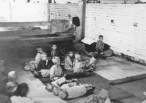 Children sit and sleep on the floor at Sisak, a Ustasa (Croatian fascist) concentration camp for children. Yugoslavia, during World War II..jpg