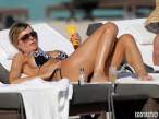 rita-rusic-black-bikini-tanning-miami-15-580x435.jpg
