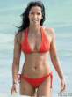 padma-lakshmi-in-an-orange-bikini-at-the-beach-05-435x580.jpg