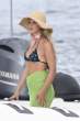 millie-bobby-brown-in-bikini-top-at-a-boat-in-sardinia-07-07-2022-6.jpg